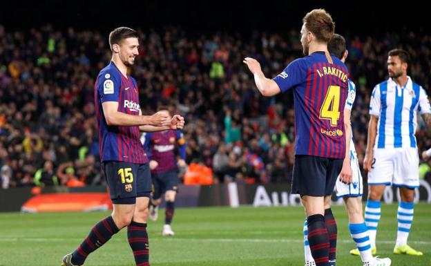 Lenglet (i) celebra el 1-0 con Rakitic. 