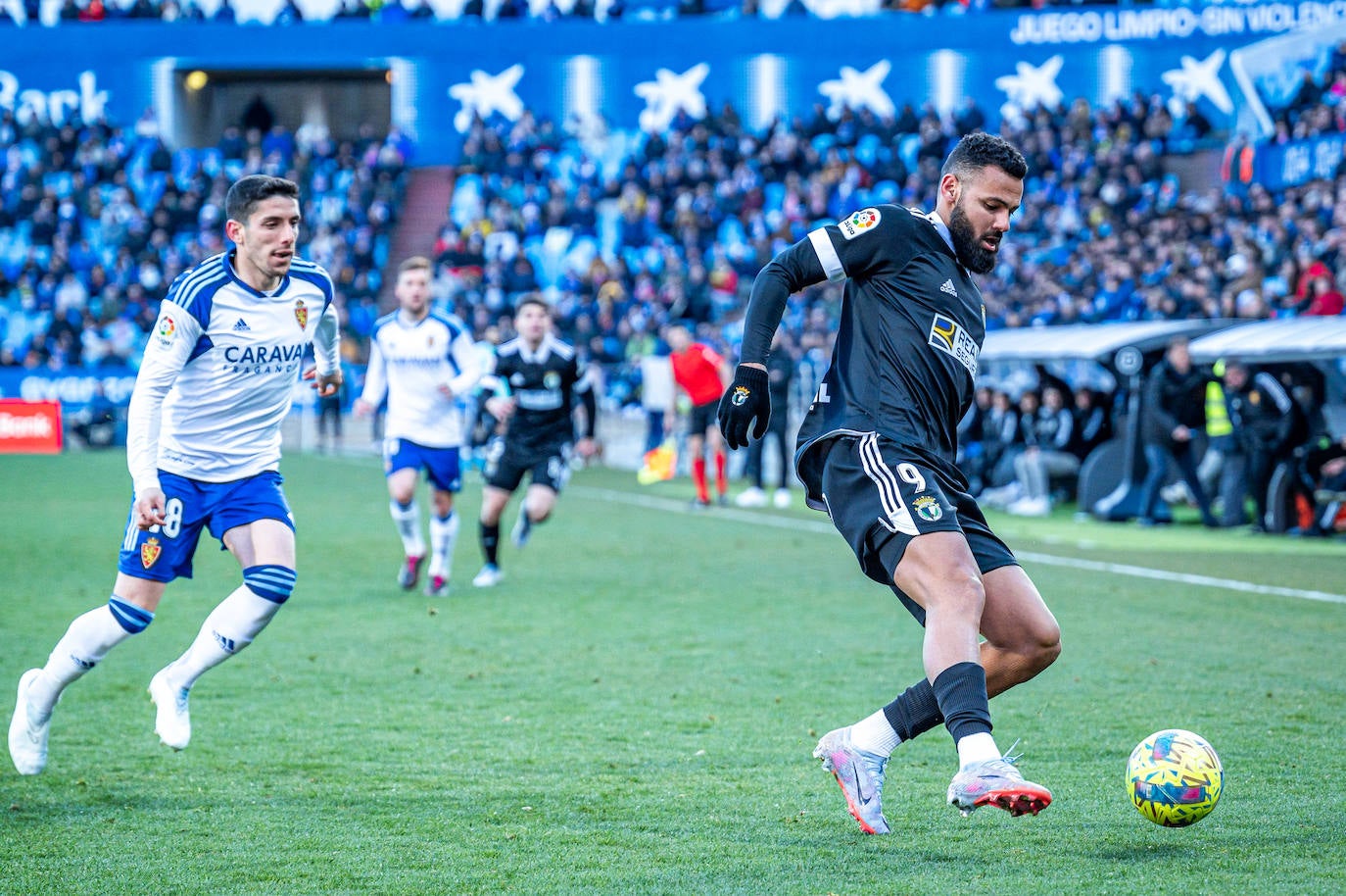 Fotos: El Burgos CF araña un punto en La Romareda