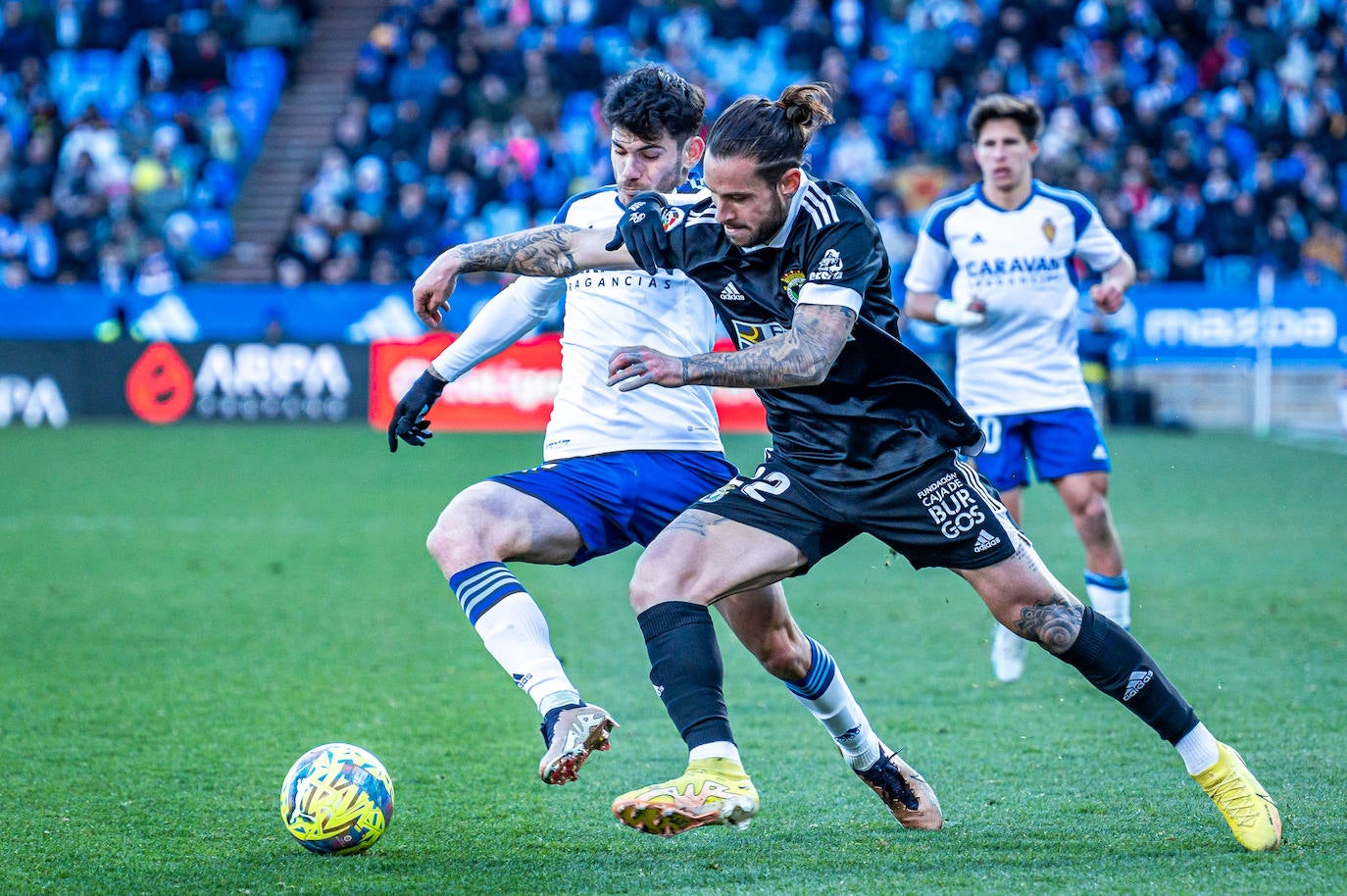 Fotos: El Burgos CF araña un punto en La Romareda