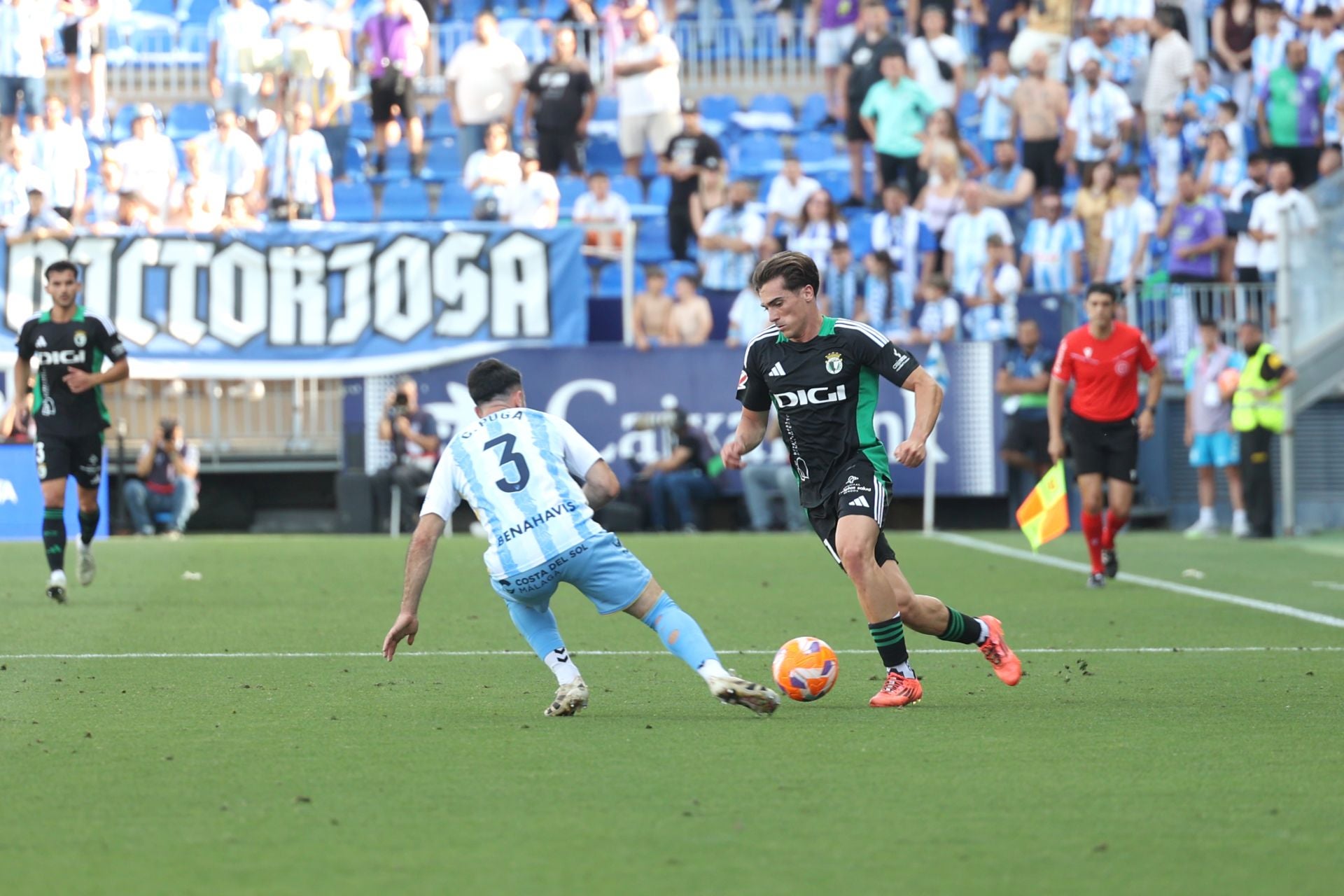 El encuentro del Málaga y del Burgos CF en La Rosaleda, en imágenes