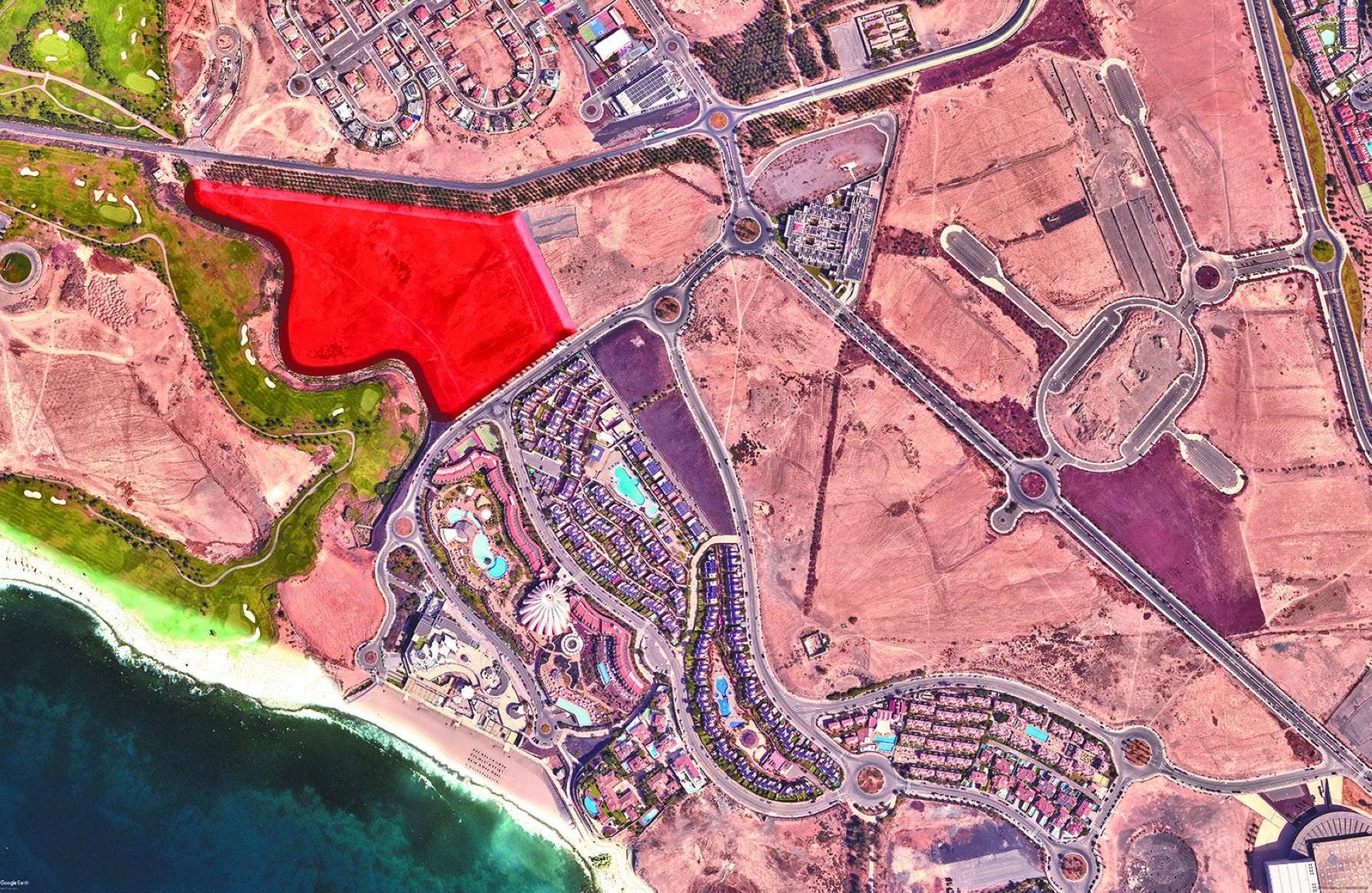 Vista aérea de Meloneras. La parcela que ha de pasar a rústica es la que aparece coloreada.