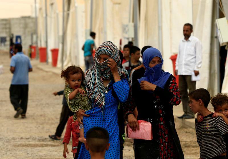 Imágenes de niños en el campamento de ACNUR preparado para los refugiados en Hammam al-Alil 