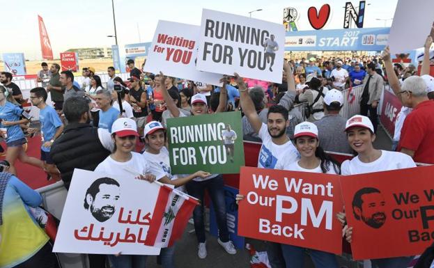 Seguidores de Saad Hariri durante una carrera en apoyo a su regreso al Líbano.