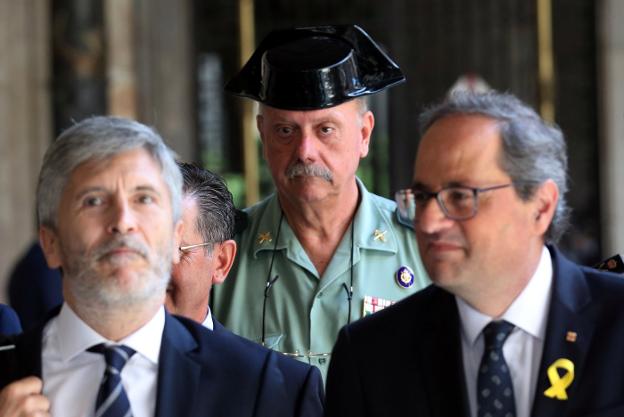 Marlaska y Torra, ayer, en el Palau de la Generalitat. :: Albert gea / EFE