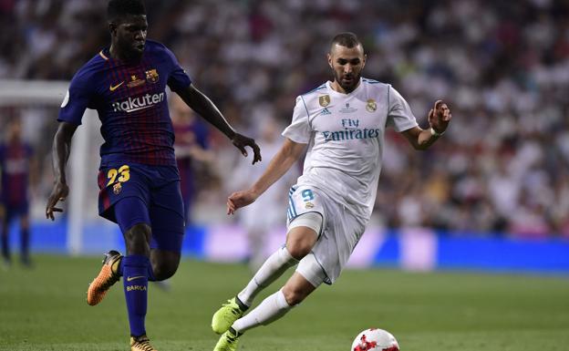 Karim Benzema y Samuel Umtiti durante un Barça-Madrid