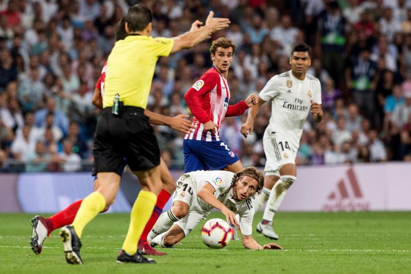 Modric y Griezmann, en un lance del partido