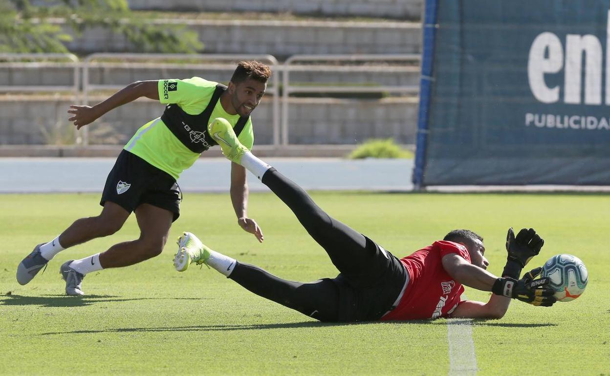 Benkhemassa, con Munir en un entrenamiento reciente. 