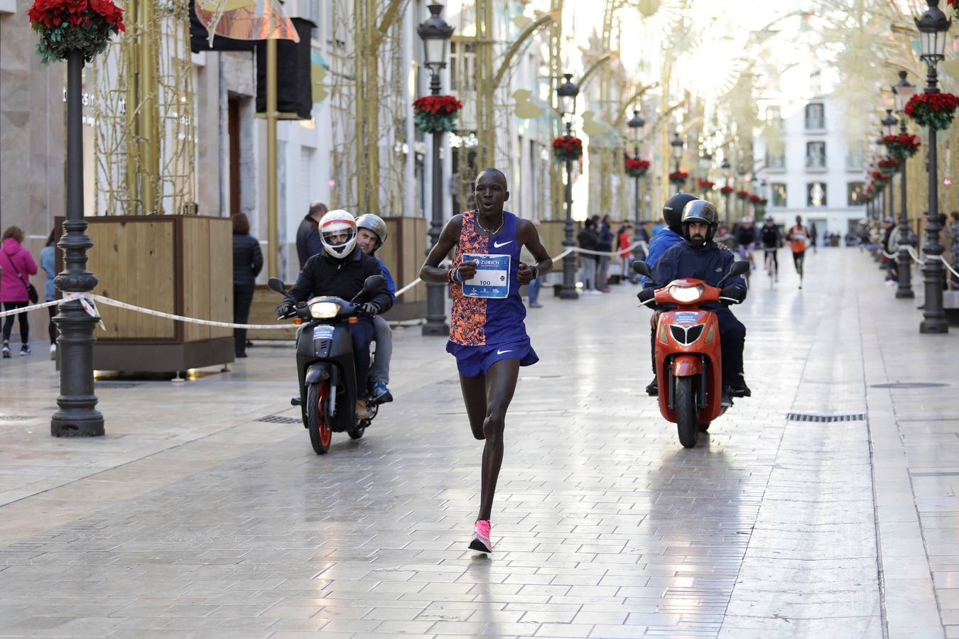 Los corredores, en calle Larios