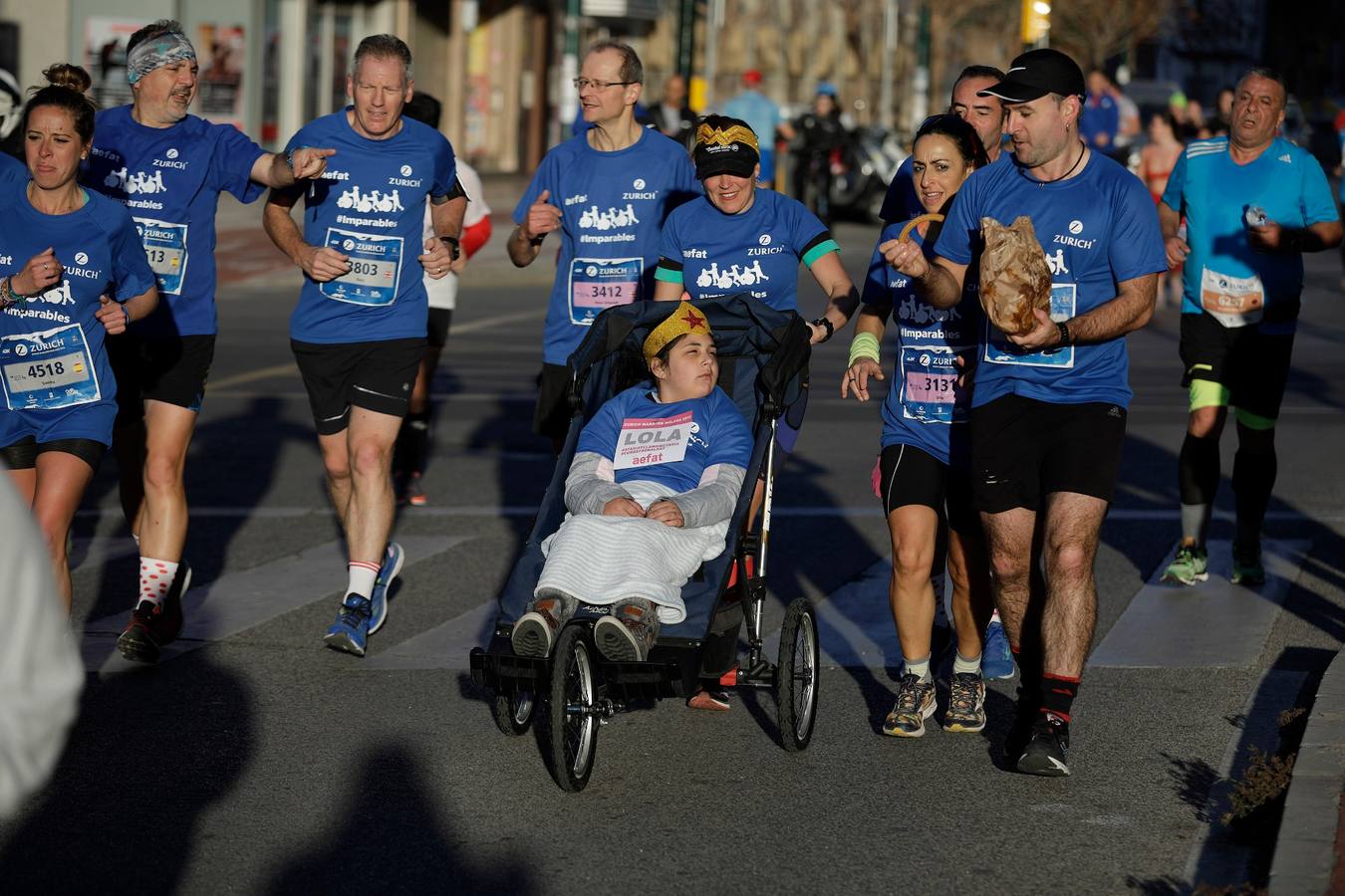 En la imagen, los corredores, en calle Princesa