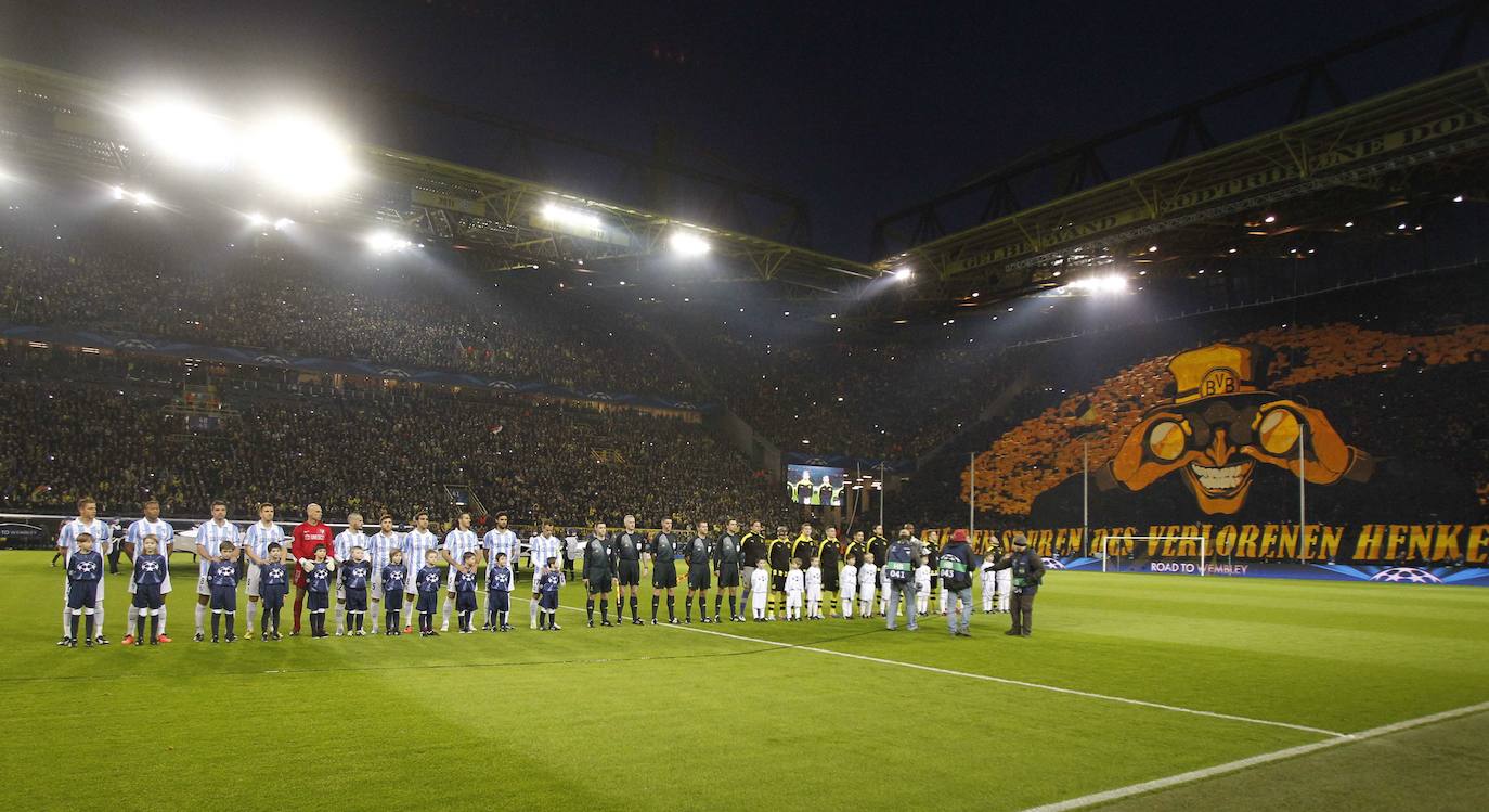 La injusta eliminación del Málaga en la Champions en el campo del Dortmund cumple hoy siete años con las mismas dudas que el primer día. Revive aquel momento foto a foto.