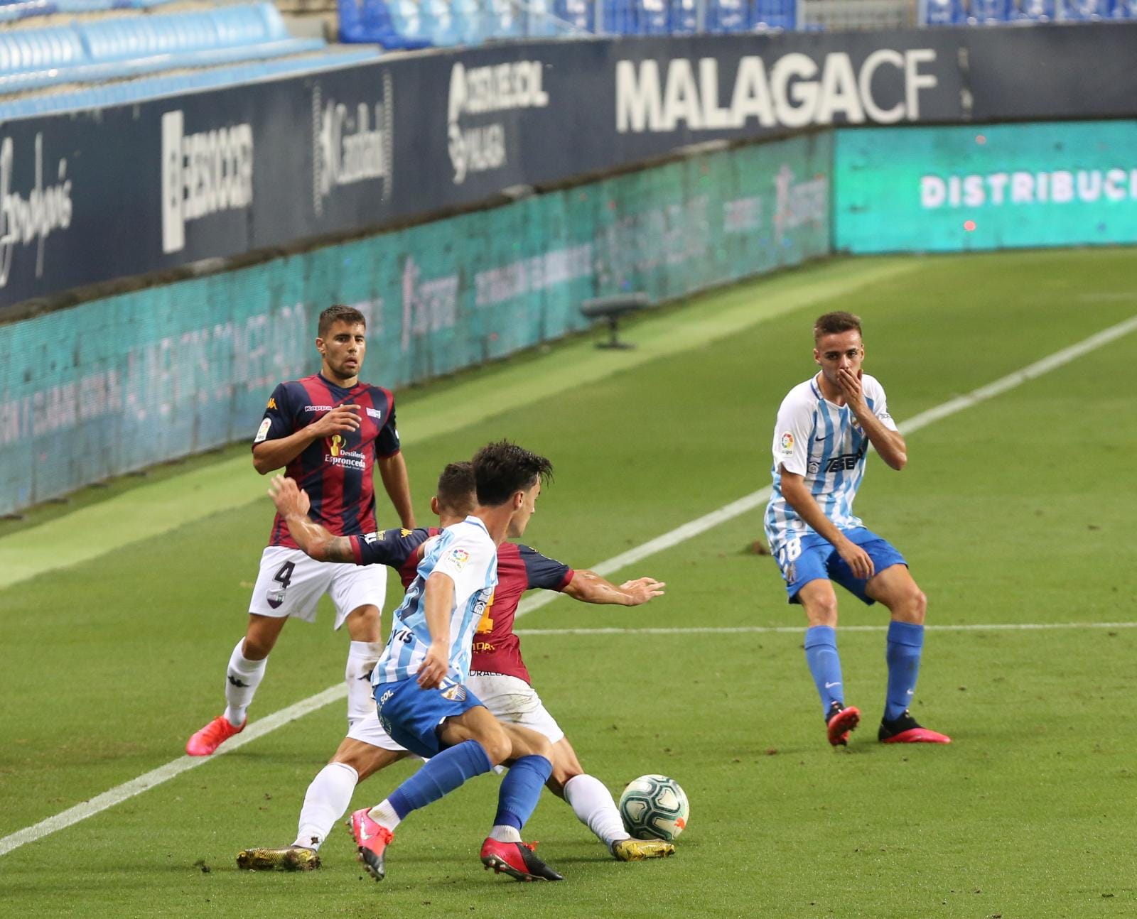 Todos los momentos del partido en imágenes desde La Rosaleda, que por segunda vez abre sus puertas para el fútbol pero sin aficionados en las gradas. 