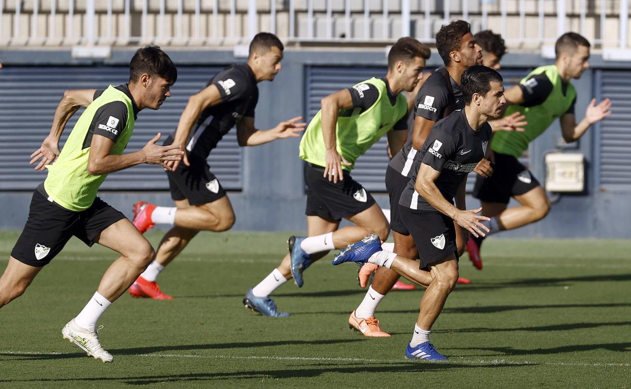 Jozabed, Benkhemassa y Matos, en primer plano, en un entrenamiento en La Rosaleda. 