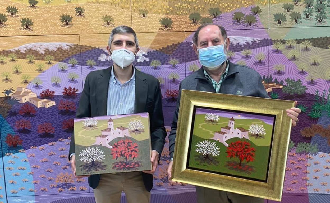 Evaristo Guerra con la obra realizada expresamente Para Fernando Mira, 'Pascuero entre almendros', para ilustrar las cajas de Navidad de Casa Mira. 