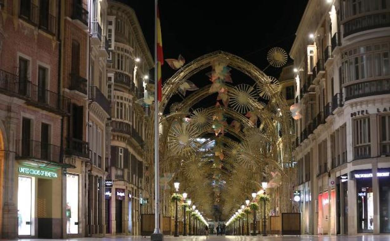 Imagen reciente de calle Larios vacía por el toque de queda nocturno. 