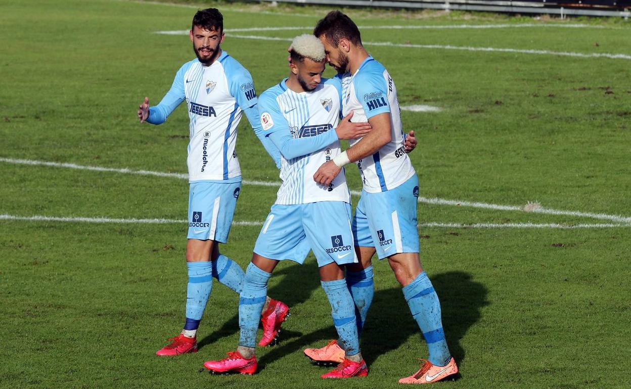 Cristian, Hicham y Orlando Sá, tras el gol de este último el año pasado en el partido copero ante el Coruxo. 