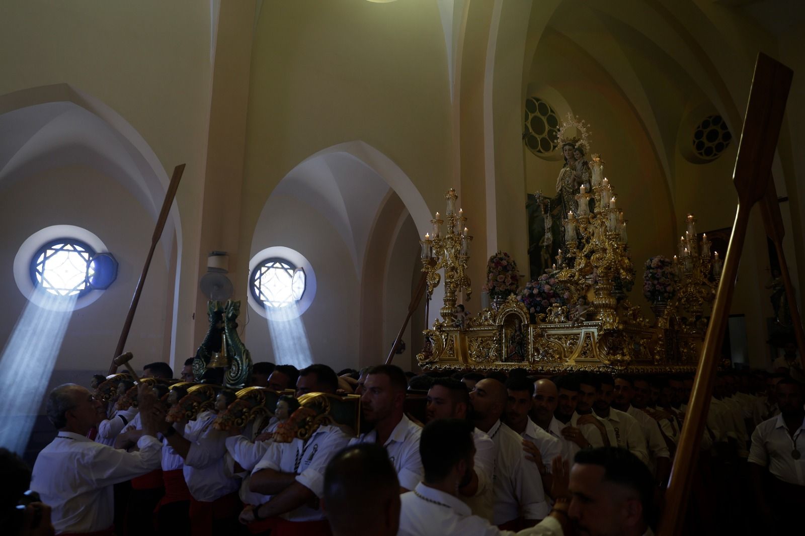 La procesión de la Virgen del Carmen de Huelin, en imágenes