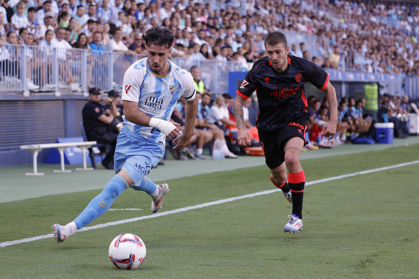 El Málaga-Huesca, en imágenes