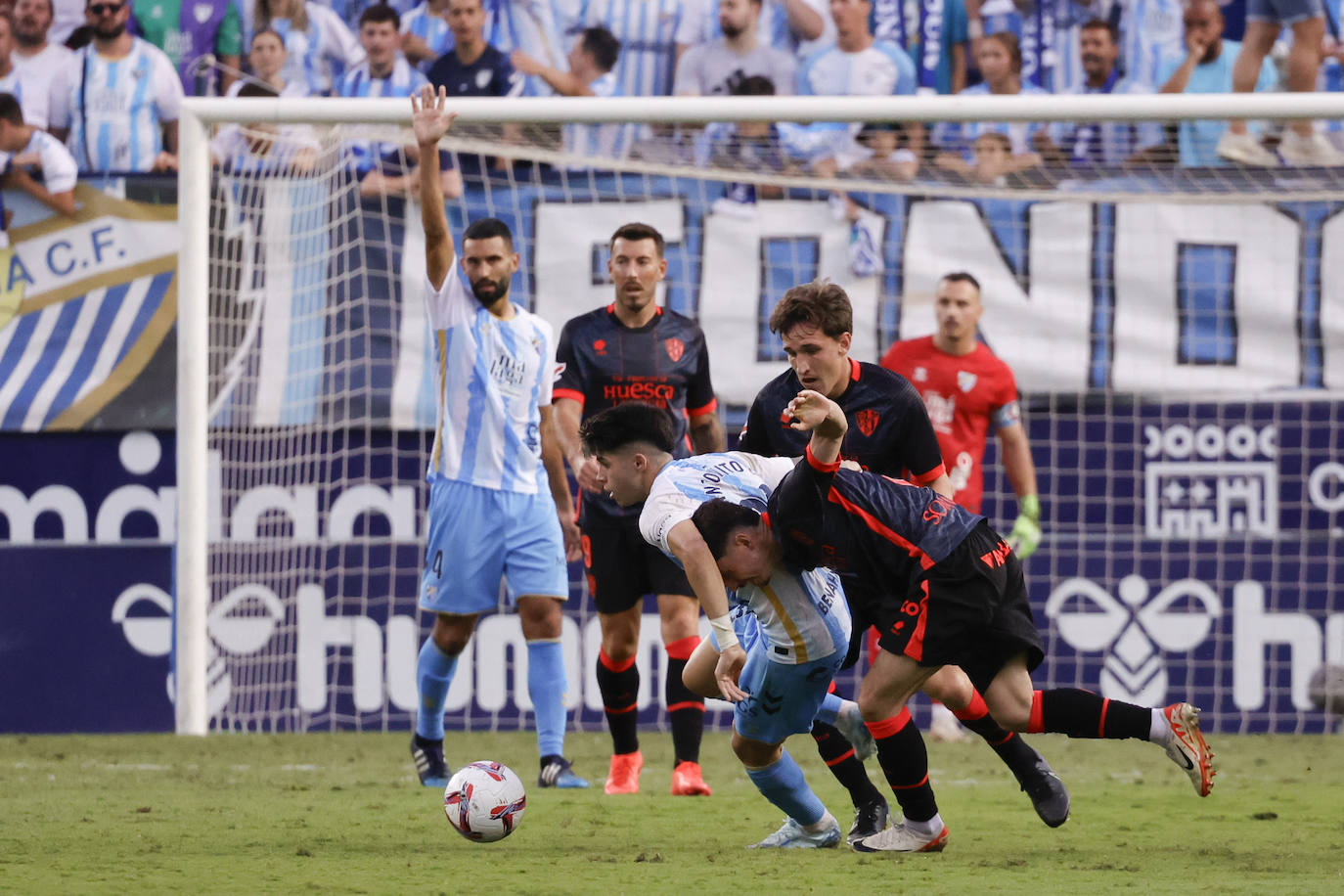 El Málaga-Huesca, en imágenes