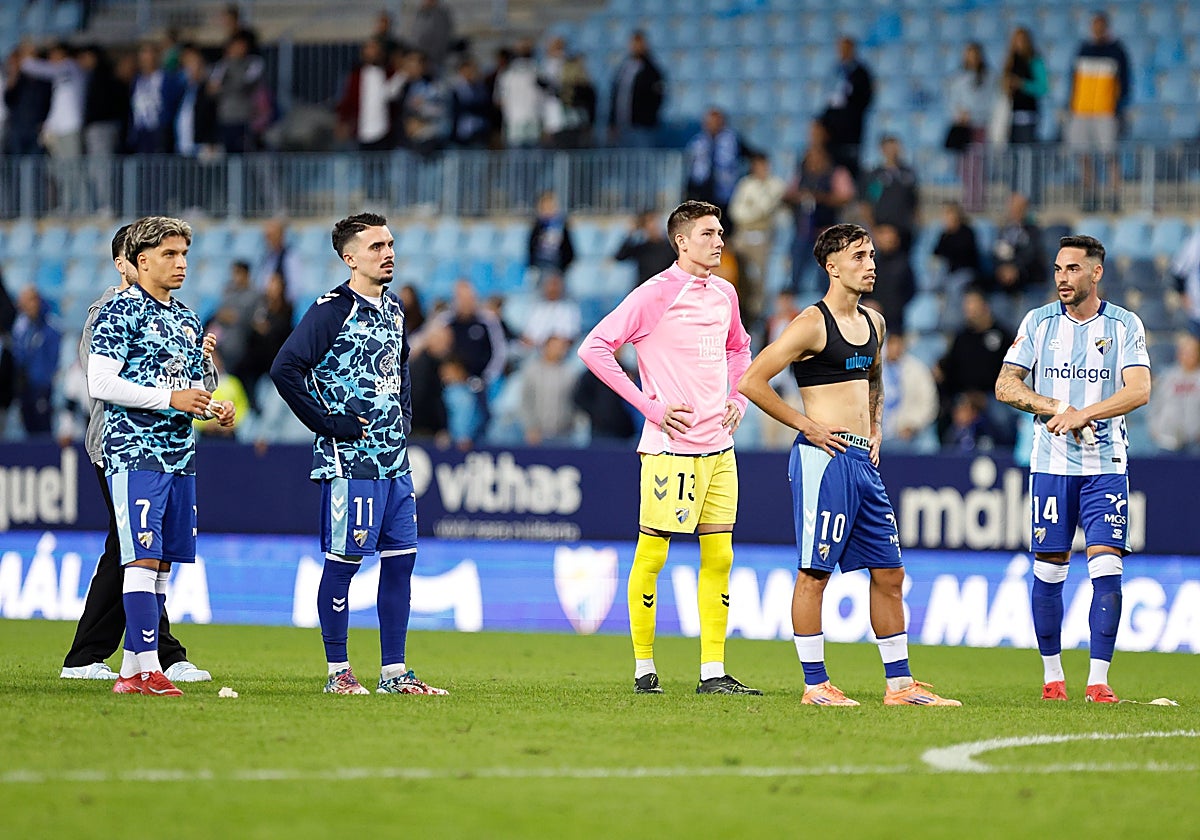 La decepción de los malaguistas tras el partido.