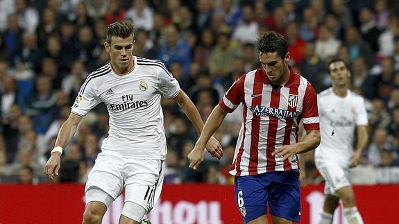 Gareth Bale y Koke.