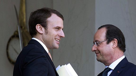 Emmanuel Macron, con Hollande.