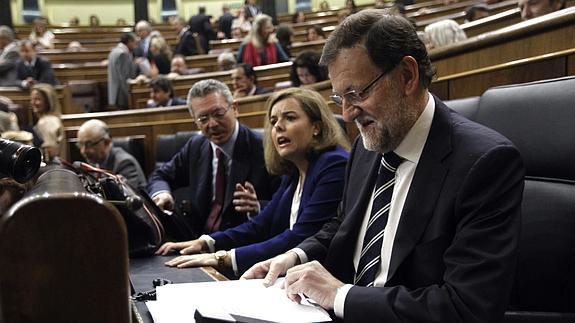 Sáenz de Santamaría, junto a Rajoy y Gallardón. 