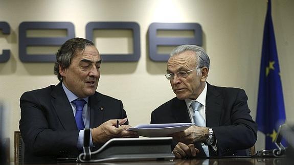 Rosell y Fainé, durante la firma del convenio.