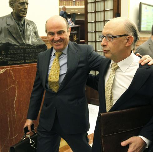 Luis de Guindos y Cristóbal Montoro.