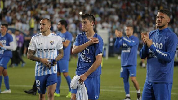 Sandro, Ricca y Demichelis, en primer plano, ayer después del encuentro en La Rosaleda.