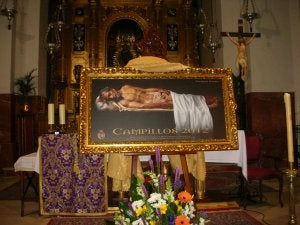 Cartel del Entierro de Campillos, que muestra en horizontal la imagen del Cristo yacente. ::
SUR