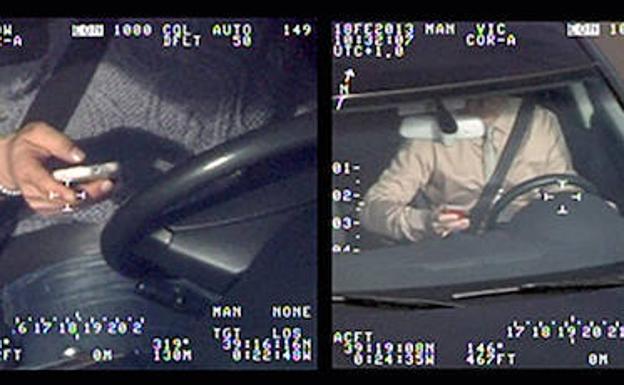 Un conductor, captado por el radar Pegasus de los helicópteros de la DGT, utiliza el móvil al volante.