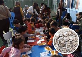 La ong reparte comida a mujeres y niños en Lesbos.