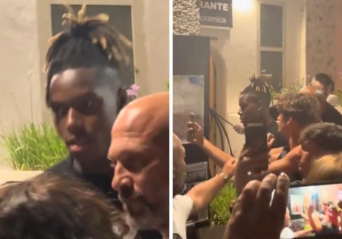 Nico Williams en la salida del restaurante del que tuvo que salir escoltado al encontrarse con una multitud de personas.