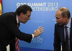 Mariano Rajoy junto a Putin. / Efe