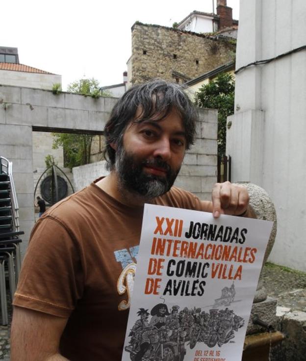 Jorge Iván Argiz, con el cartel de las XXII Jornadas. 
