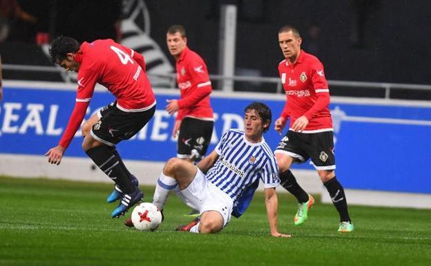 Un lance del partido entre el Caudal y la Real B. 