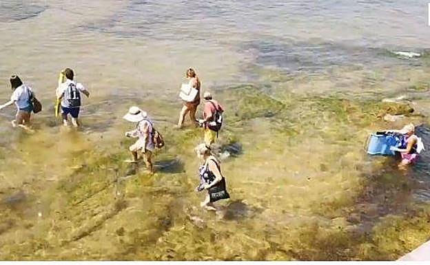 Picaresca en la playa de San Lorenzo para esquivar las limitaciones de aforo
