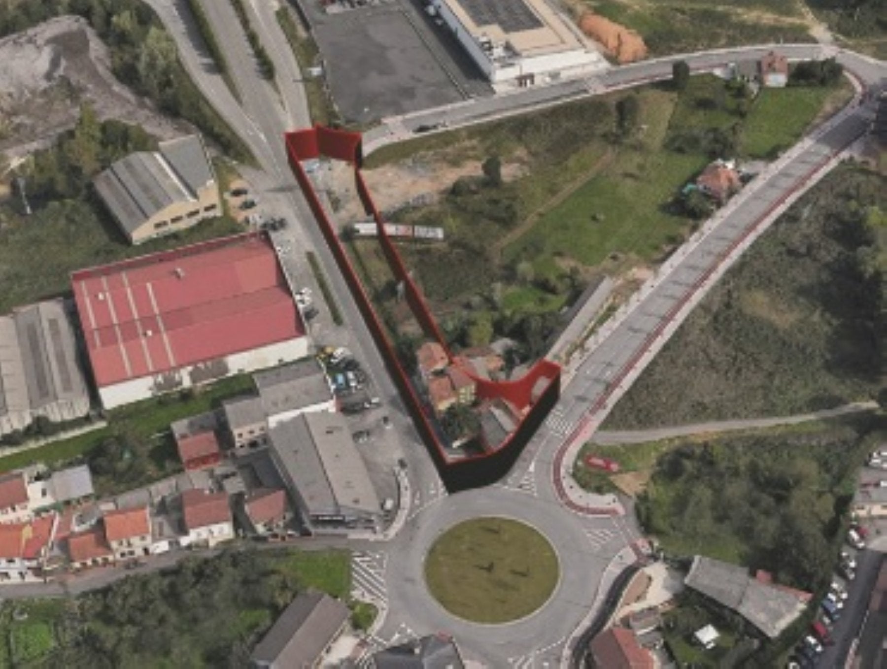 La rotonda de El Castro, en Lugones, con la zona afectada por las expropiaciones marcada en rojo.