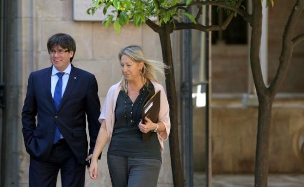 Carles Puigdemont y Neus Munté.