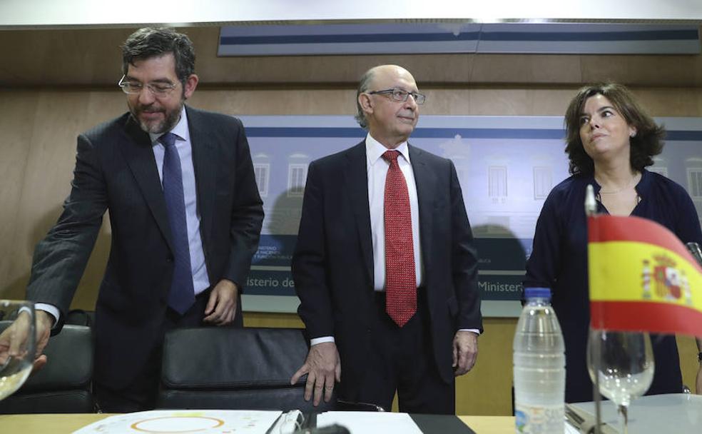 Nadal, Montoro y Sáenz de Santamaría, antes de un Consejo de Política Fiscal y Financiera.