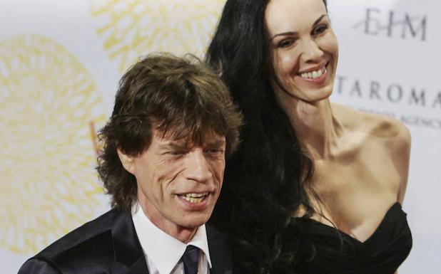 Jagger, acompañado de su pareja L'Wren Scott, ya fallecida. 