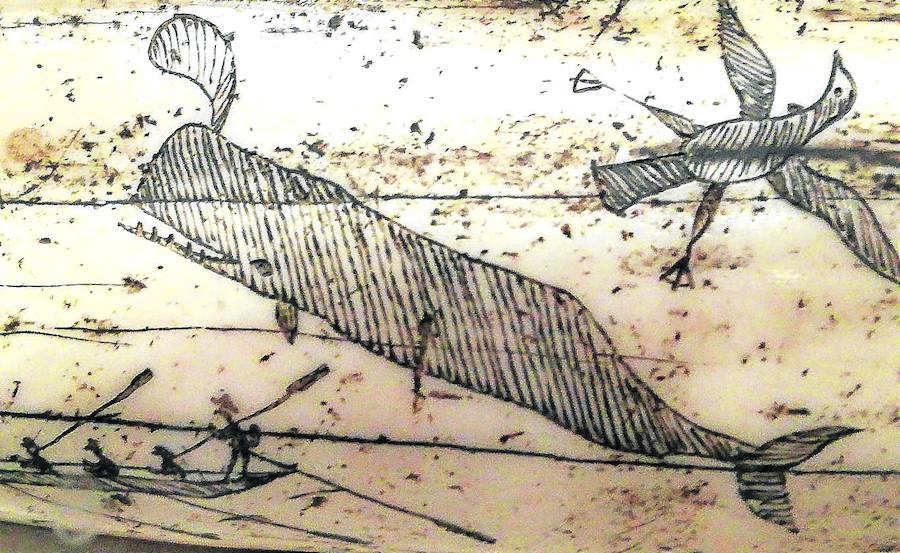 scena de balleneros vascos de caza en aguas islandesas, tallada en un hueso de cetáceo. Se exhibe en el Museo Húsavik.