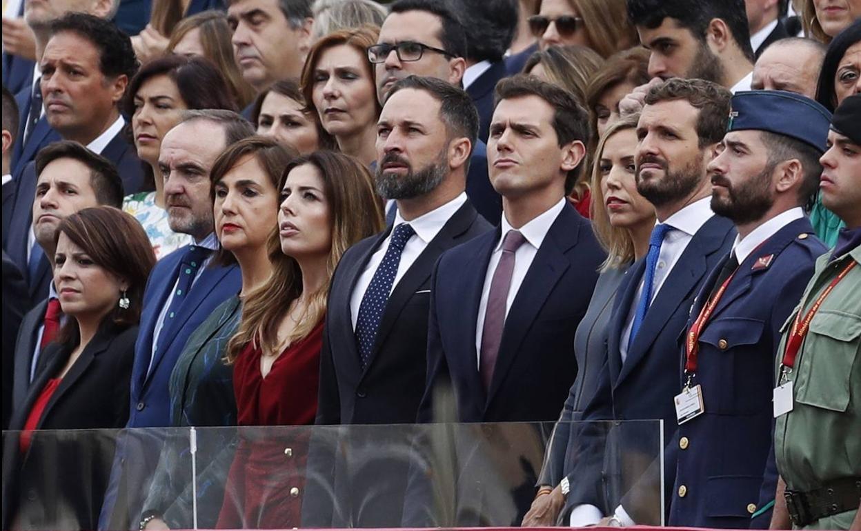 Abascal, Rivera y Casado, durante el desfile del 12 de octubre.