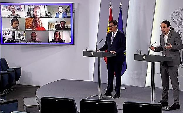 Salvador Illa y Pablo Iglesias, durante su comparecencia. 