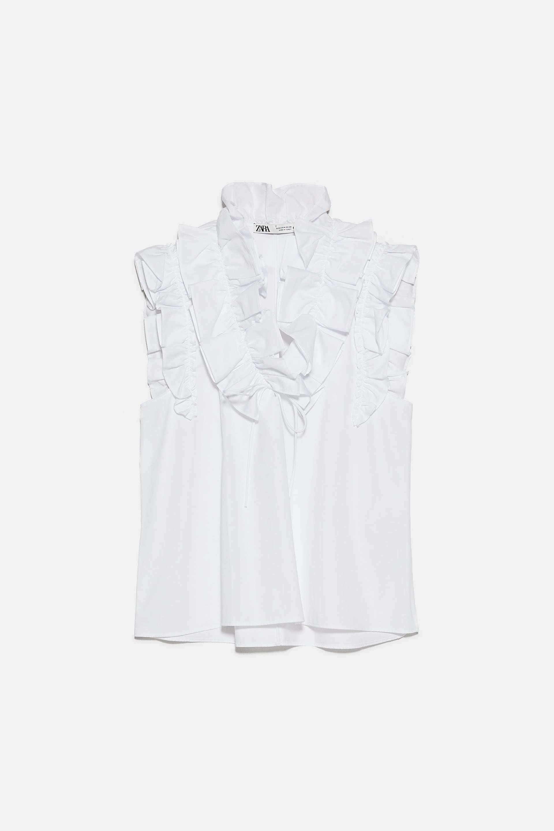 Blusa de popelín con volantes, de Zara (25,95 euros).