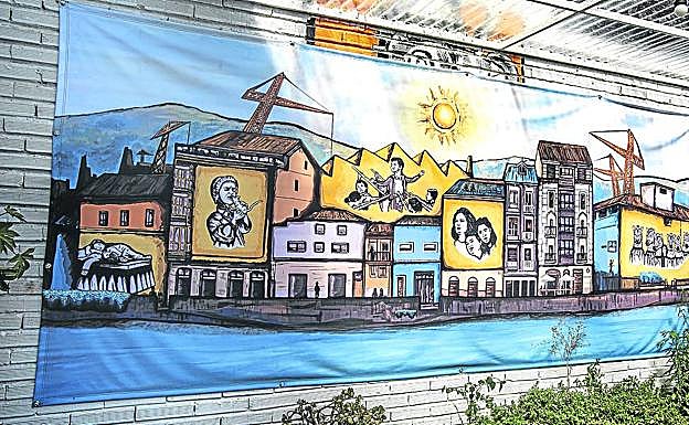 Horizonte. El mural de Hiruzelai recrea obras de la Compañía Joven en las fachadas de la ribera. 