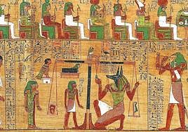 Anubis pesando el corazón del difunto, que para salvar su alma debe ser más liviano que la pluma de la diosa Maat.