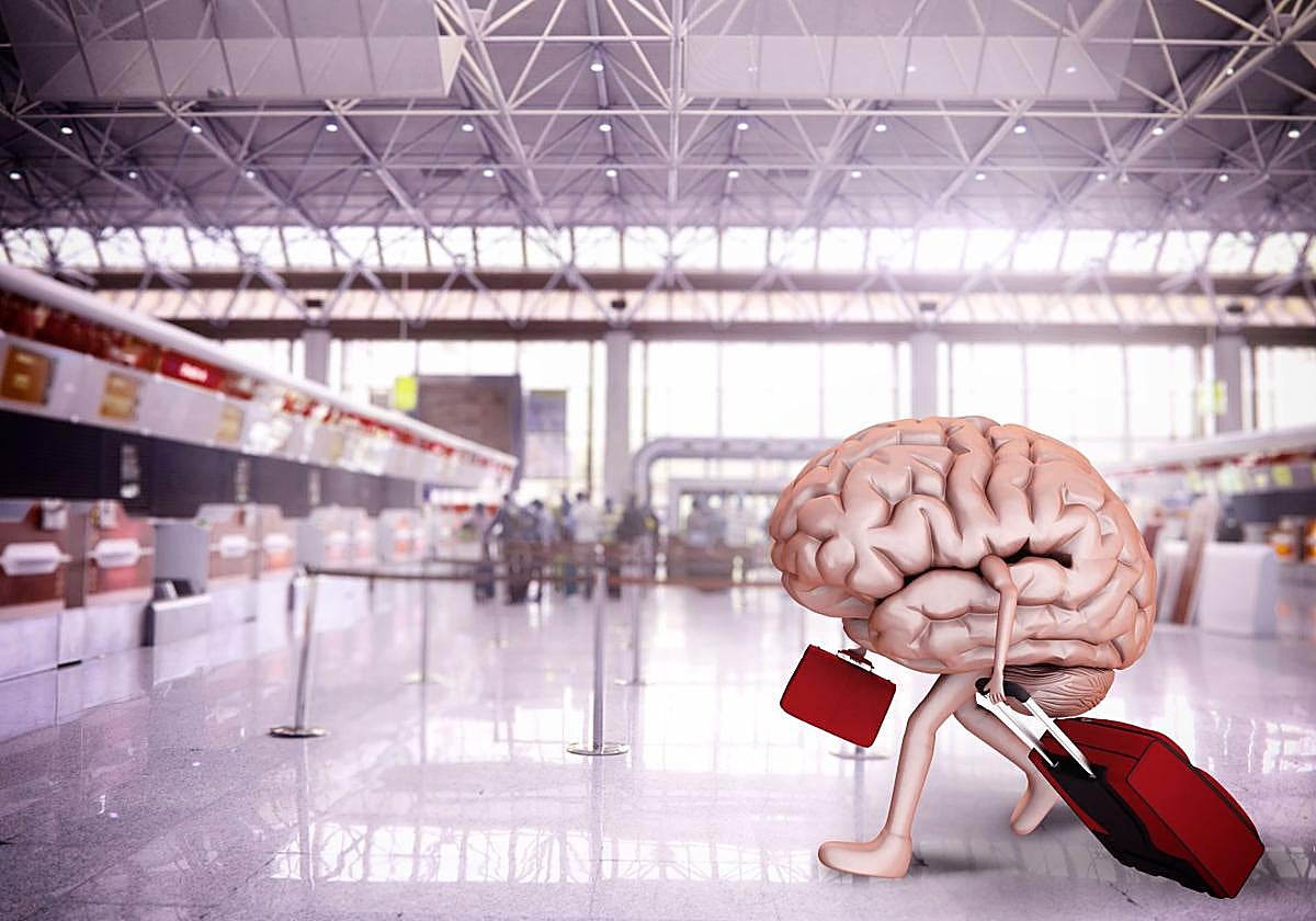 Un cerebro con equipaje en el aeropuerto.
