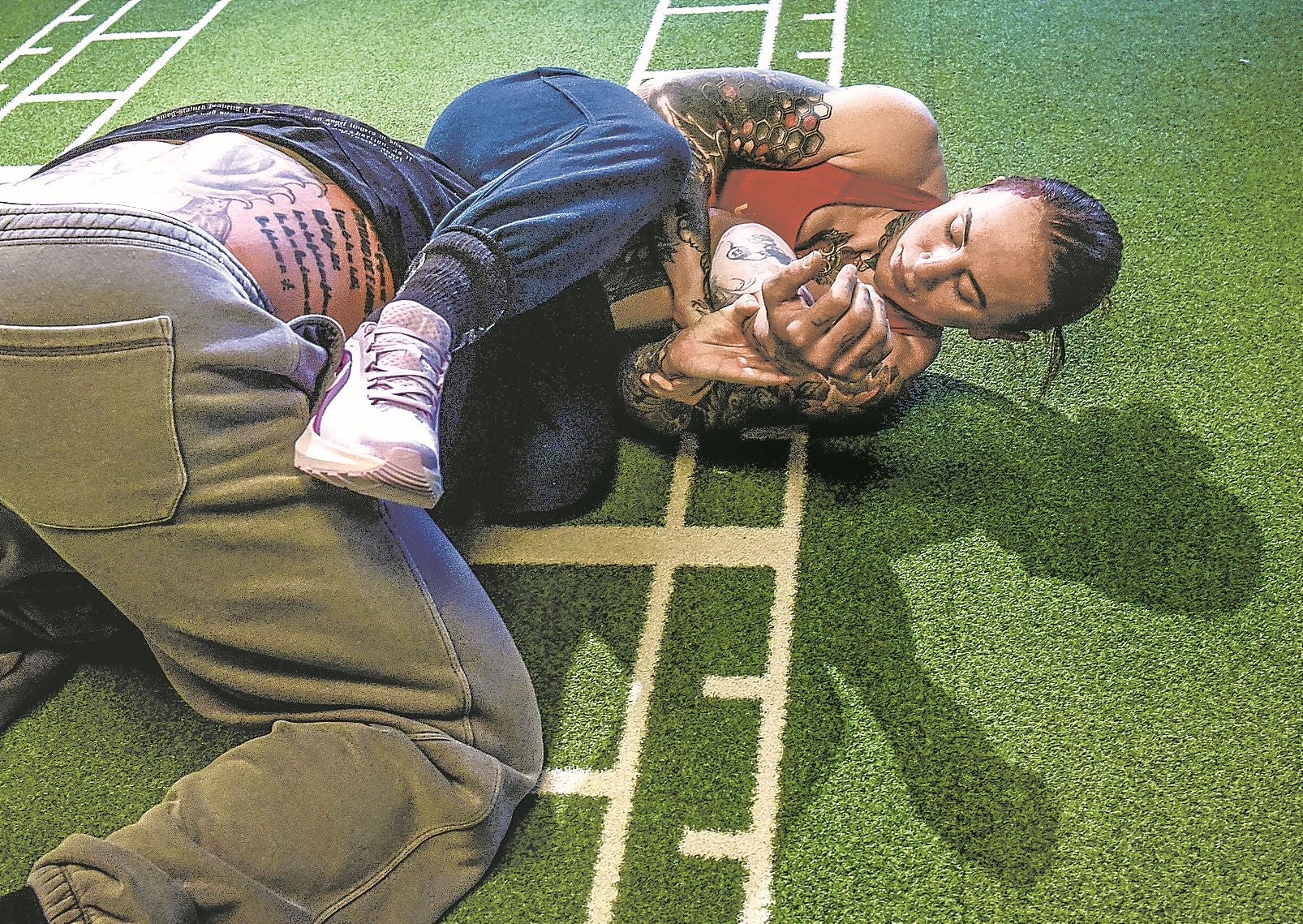 Aitana Álvarez performs a movement with her coach.