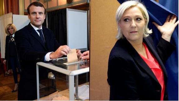 Macron y Le Pen, en el momento de votar esta mañana.